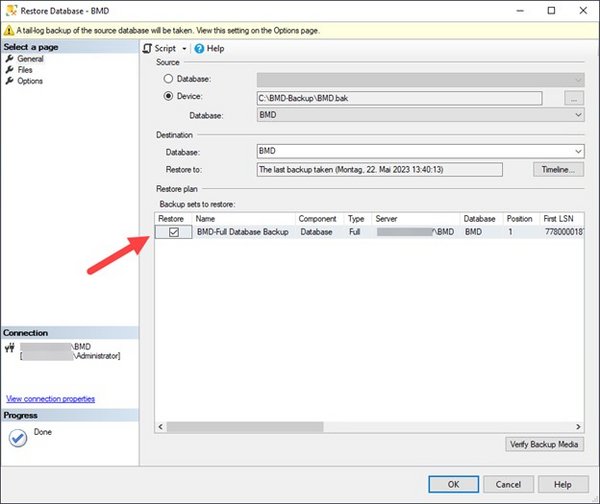 Screenshot of the "Restore Database" window; an arrow points to the checkbox for "Restore".