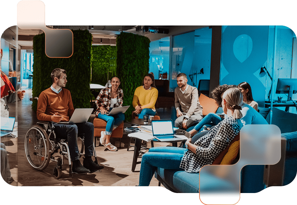 Ein diverses Team von mehreren Personen in einem modernen Büroraum.